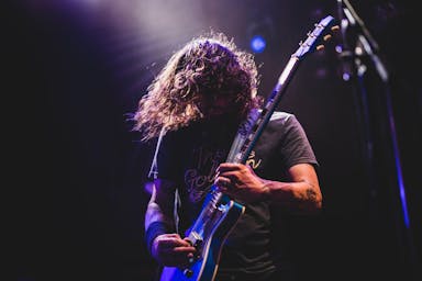 man playing electric guitar