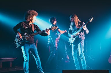 man and woman playing guitars