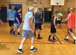 A group of people playing basketball

Description automatically generated with medium confidence