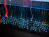 a close up of a computer keyboard with colorful lights