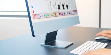 silver imac on white table