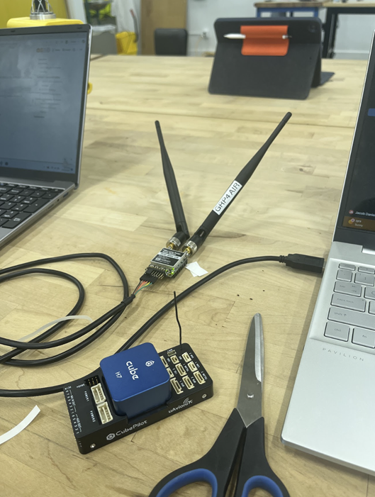 A pair of black antennas on a table next to a pair of scissors

AI-generated content may be incorrect.