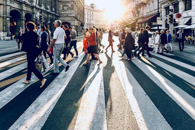 group of people walking on pedestrian lane