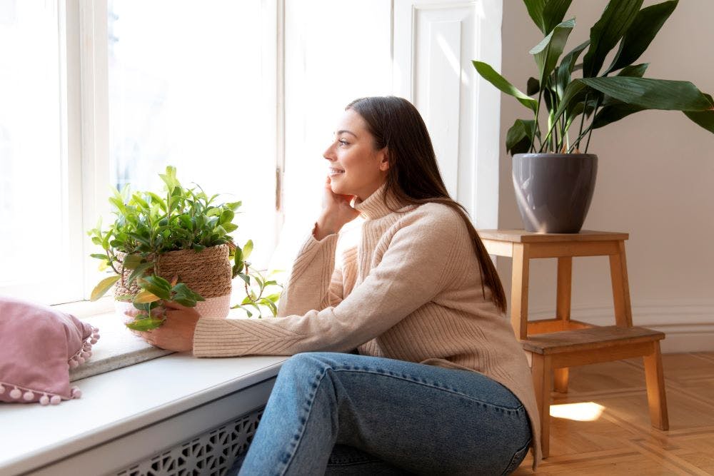 medium-shot-woman-holding-plant-pot.jpg