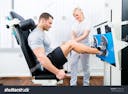 stock-photo-patient-at-the-physiotherapy-doing-physical-exercises-using-leg-press-in-sport-remobilization-197661116.jpg