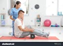 stock-photo-physiotherapist-working-with-young-male-patient-in-clinic-754548703.jpg