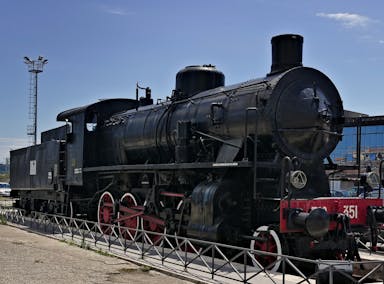black train under blue skies