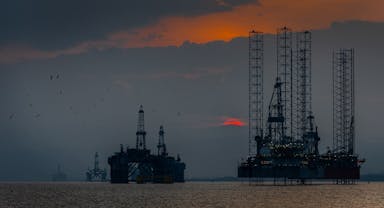 a group of oil rigs in the ocean