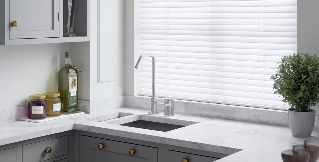 white-pvc-faux-wood-blinds-white-and-grey-kitchen.jpg