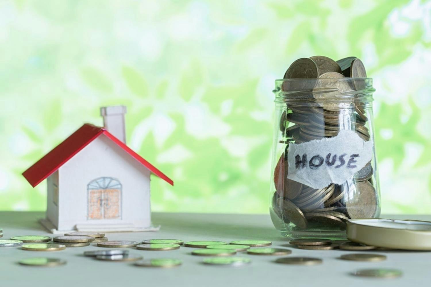 Money saving for house in the glass bottle.jpg