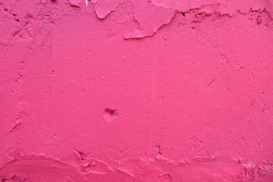 pink concrete wall during daytime