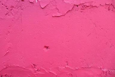 pink concrete wall during daytime