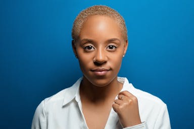 a woman in a white shirt posing for a picture