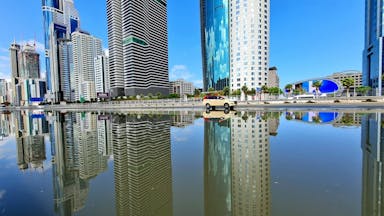 a body of water surrounded by tall buildings