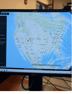 A computer monitor with a map on it

AI-generated content may be incorrect.