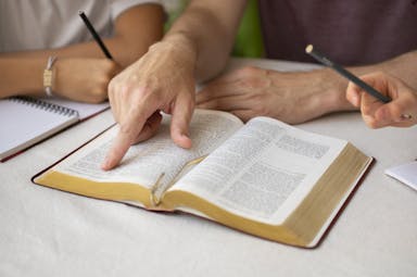 high-angle-teacher-with-bible-school.jpg