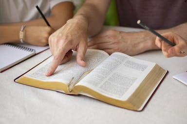 high-angle-teacher-with-bible-school.jpg