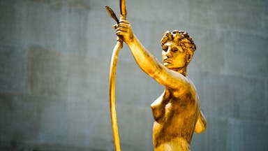 female with arrow statue