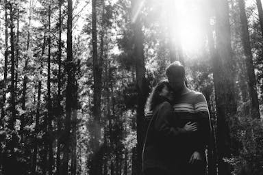 couple beside trees