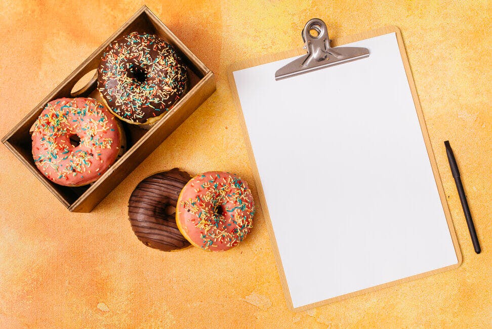 flat-lay-donut-composition-with-clipboard (1).jpg